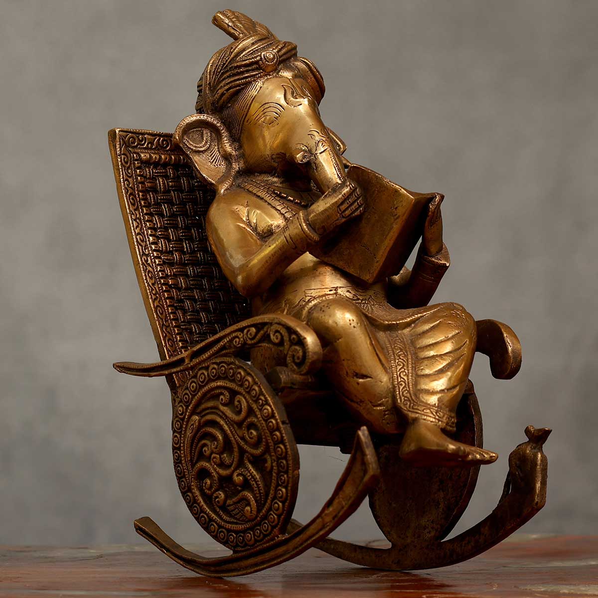 Lord Ganesha reading Idol made of Pure Brass - 7.5 x 13 x 15.5 Inch, 11.5 Kg