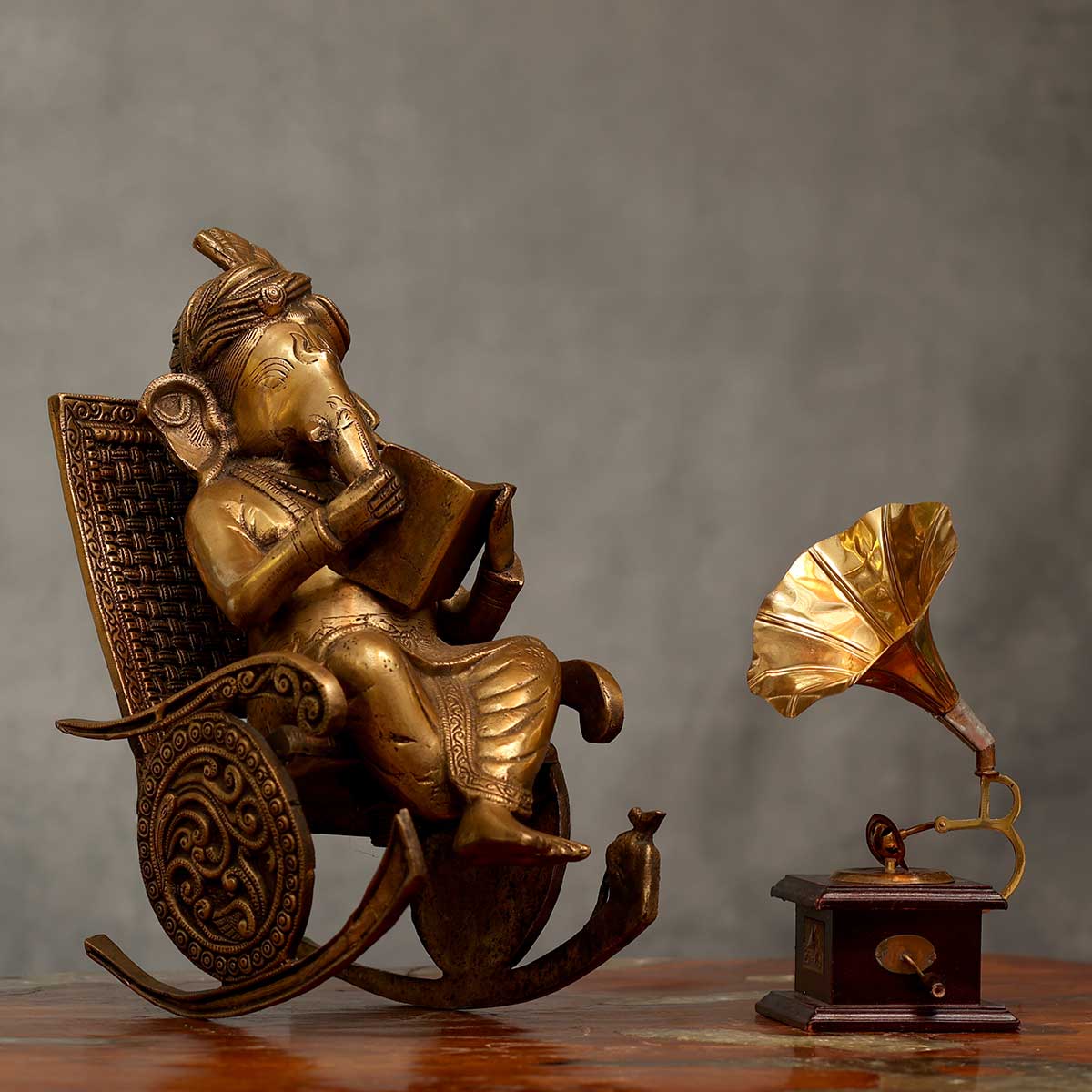 Lord Ganesha reading Idol made of Pure Brass - 7.5 x 13 x 15.5 Inch, 11.5 Kg
